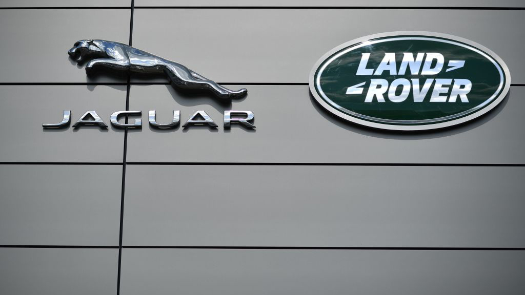 Rearview camera view with water pooling distortion on a luxury SUV screen